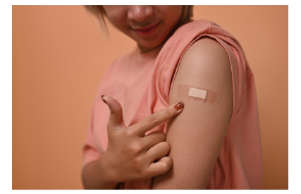 Pregnant woman with plaster on arm